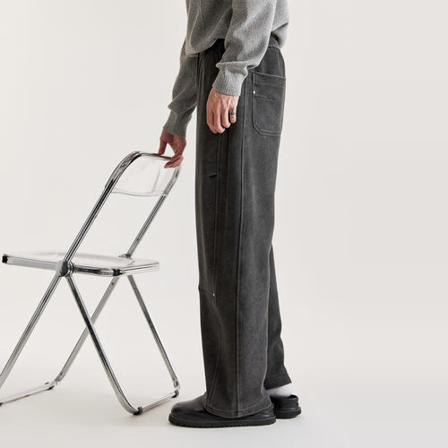 Side view of men's black washed wide-leg pants with straight leg, side seam and back patch pocket
