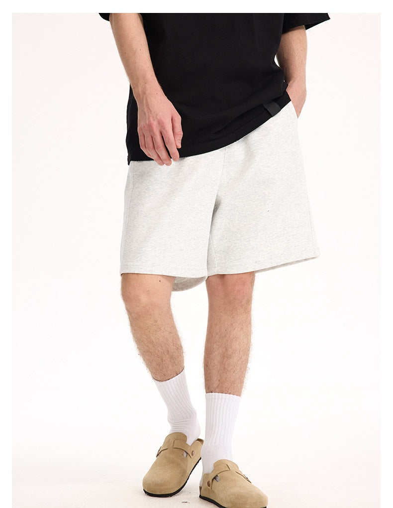 Heather gray lounge shorts, front view on model