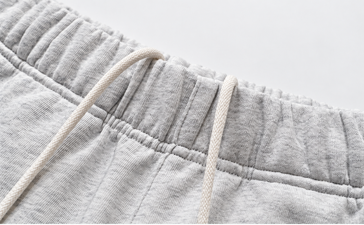 Heather gray shorts, elastic waistband and drawstring detail